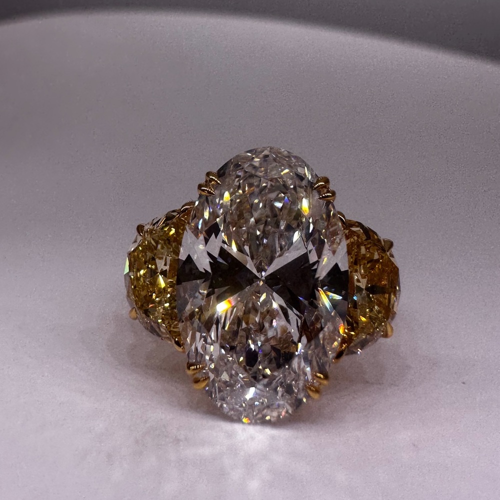 5.31 carat f vs1 oval lab diamond engagement ring with yellow diamond half moons